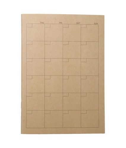表紙にカレンダーの枠が描かれた茶色いノートの写真