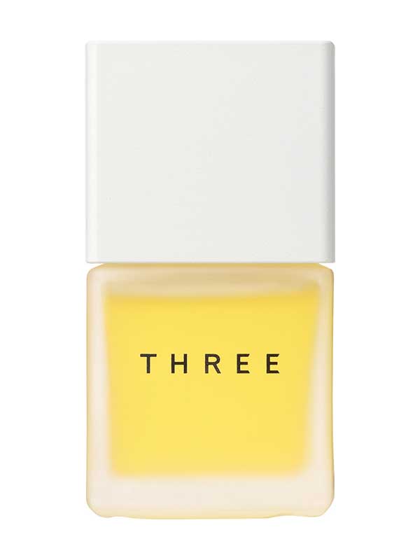 白いキャップのTHREEのオイル