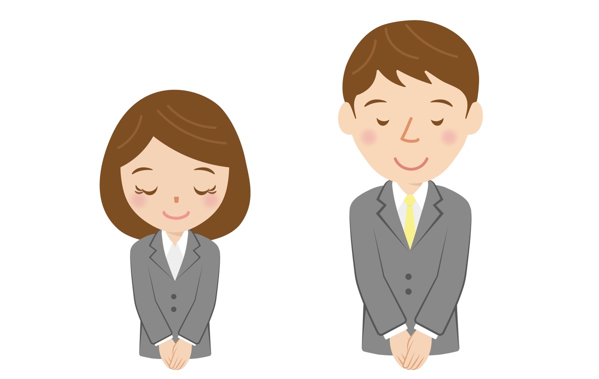 お辞儀する男女