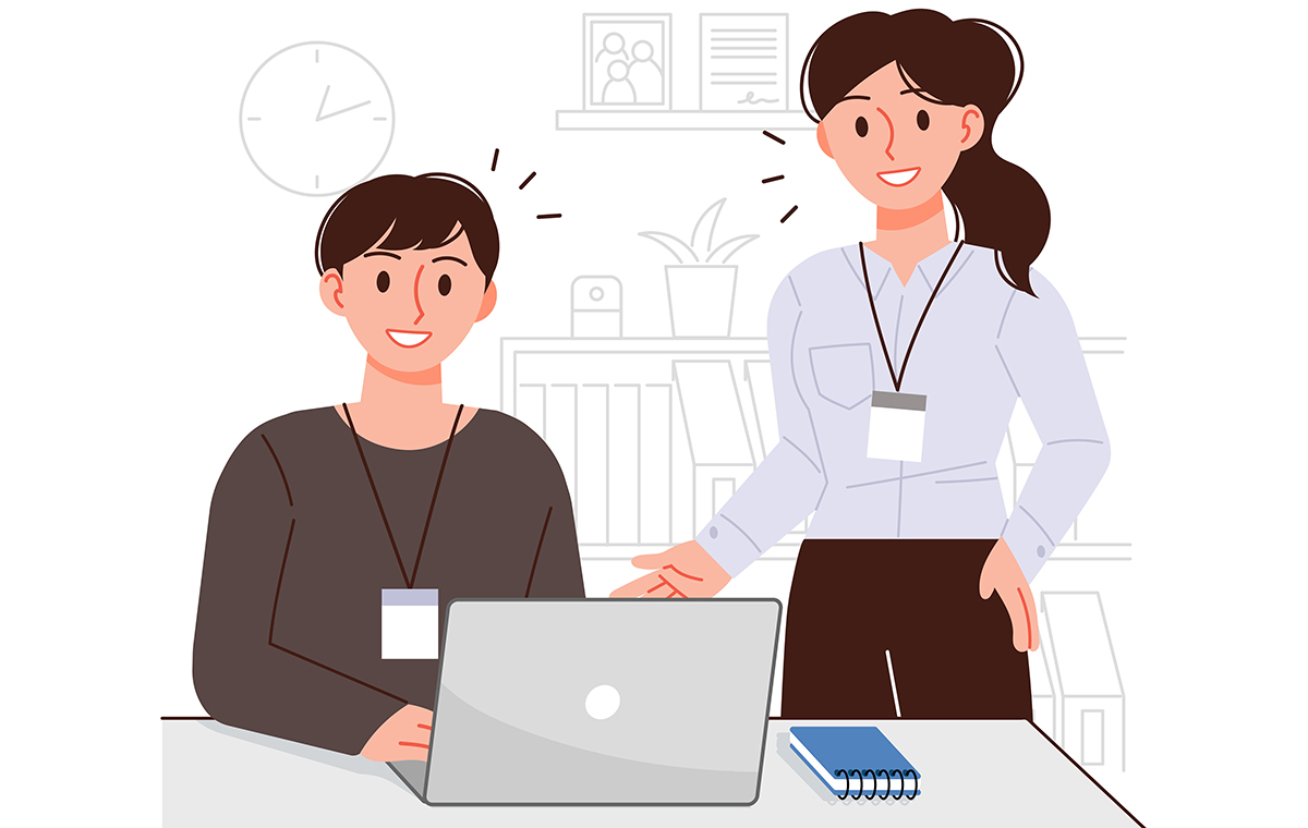 オフィスで会話をする上司と部下