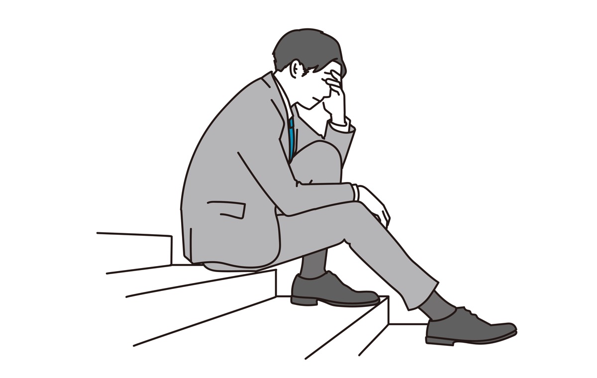 落ち込む男性