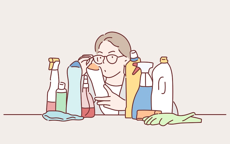 洗剤を見比べている人のイラスト