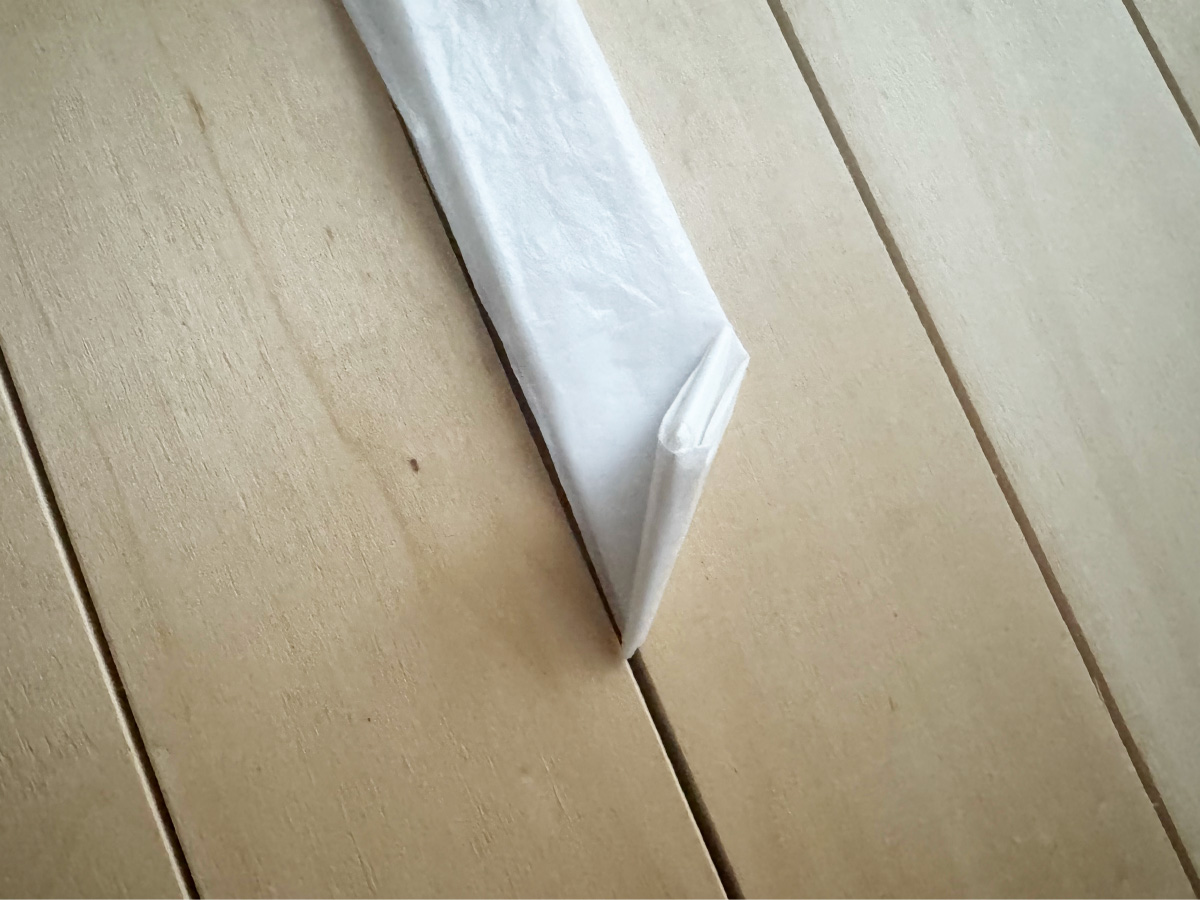 三角に折進めていく工程