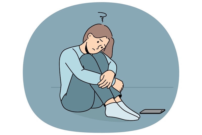 座り込んで落ち込んでいる人のイラスト