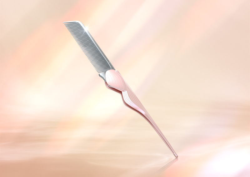 ピンクの折りたたみコームの写真